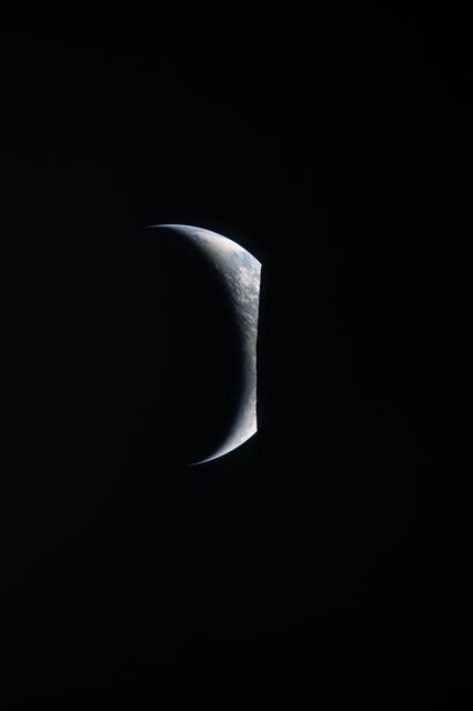 Earthrise captured through the Orion spacecraft window at...
