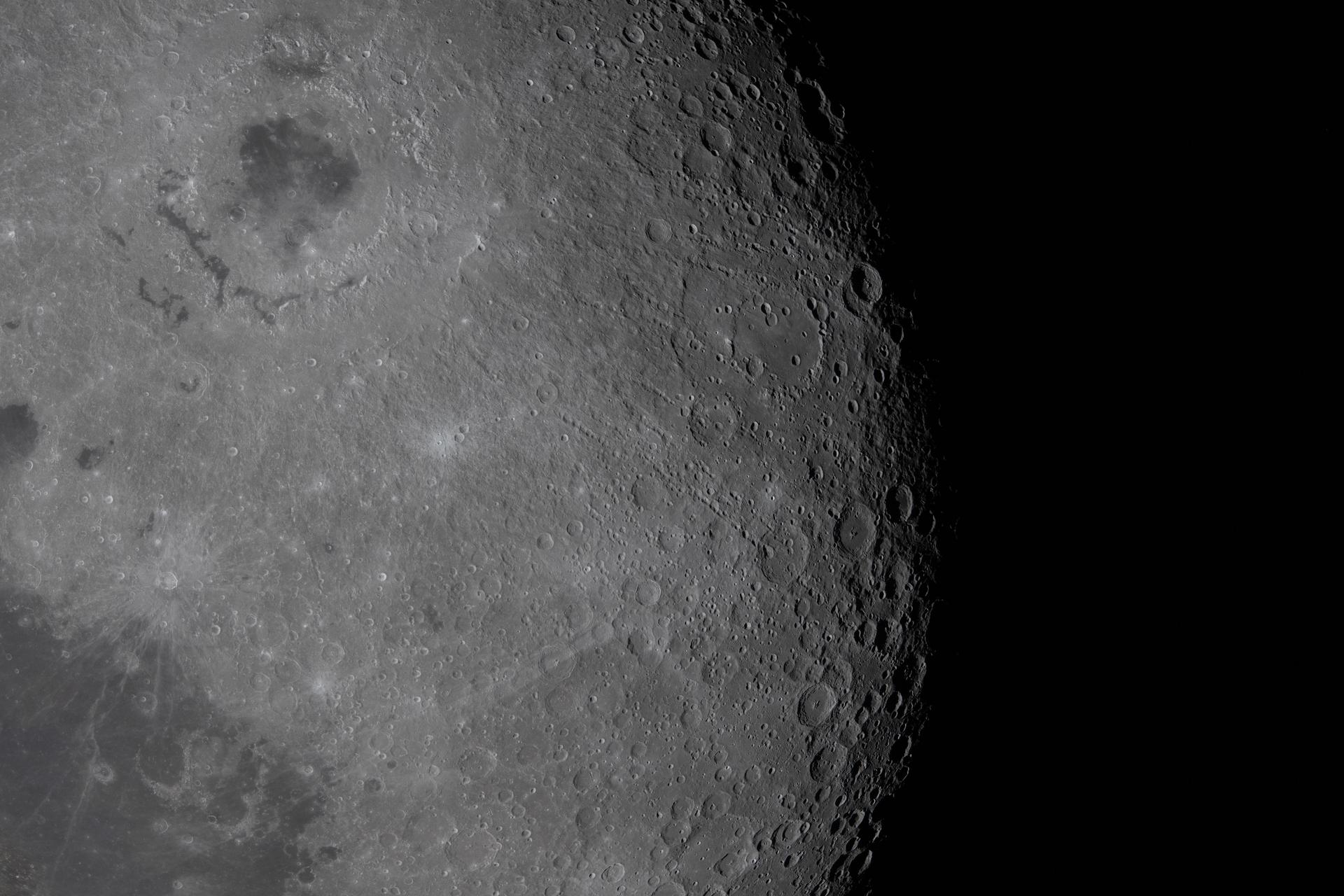 art002e009591 (April 6, 2026) – The Artemis II crew captured this view of Glushko crater and the surrounding terrain during their lunar flyby. Glushko’s bright surface and rays stand out against the surrounding terrain, while shadows along the Moon’s limb accentuate the densely cratered landscape. Sundman J. crater and an adjacent features with darker tones also are visible in the image. Credit: NASA