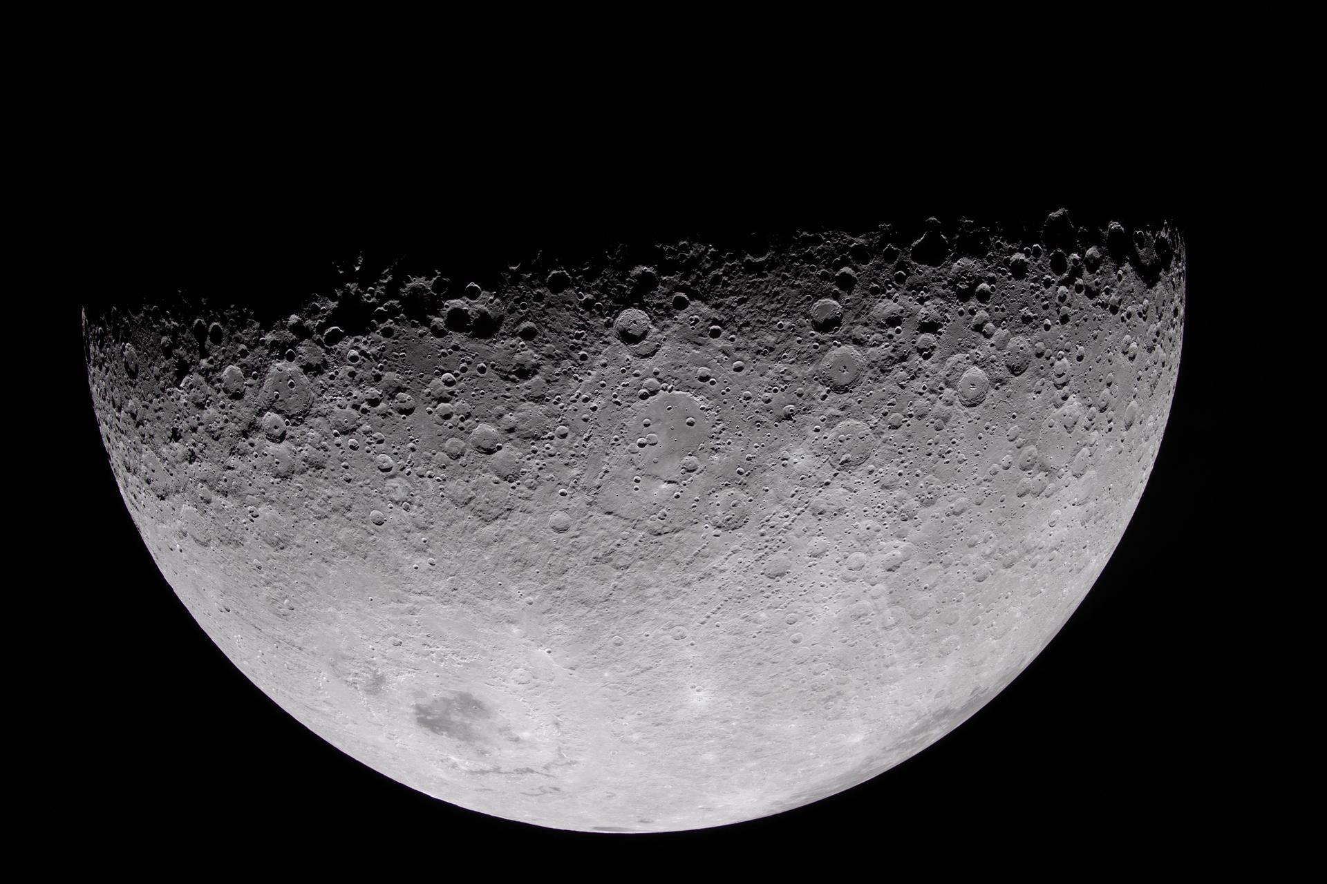 art002e010327 (April 6, 2026) – The Artemis II crew captured this view of Vavilov crater and the surrounding terrain during their lunar flyby. Brightly illuminated terrain contrasts with deep shadow along the upper edge of the Moon, where low-angle sunlight accentuates the rims and walls of numerous craters. The view highlights variations in texture and topography across Vavilov and the surrounding landscape. Credit: NASA