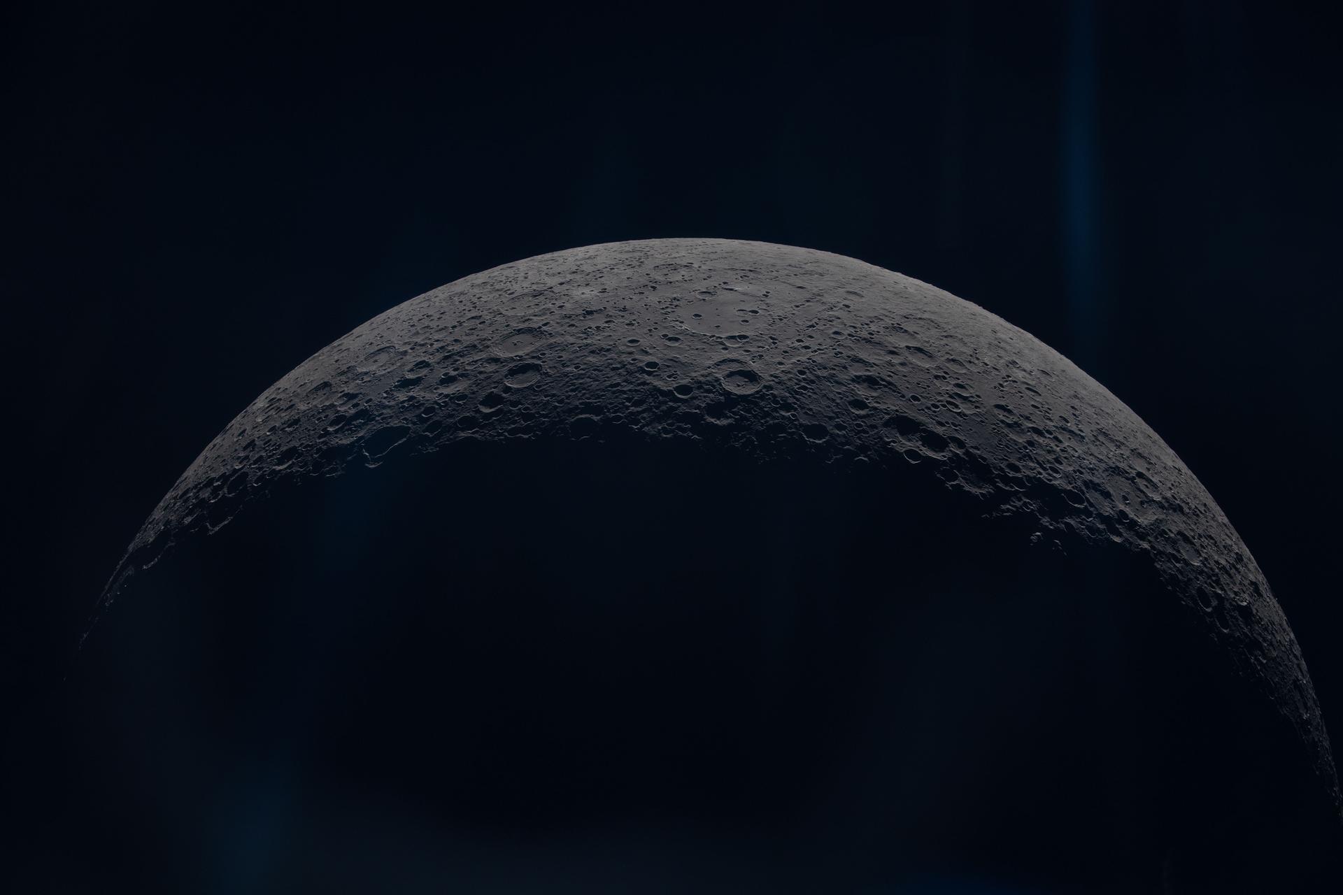 art002e012632 (April 6, 2026) - The Artemis II crew captures the Moons curved limb during their journey around the far...
