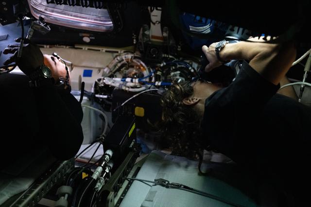 Artemis II Pilot Victor Glover, on the left, and Mission...