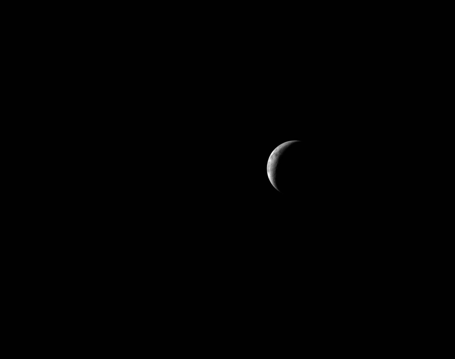 art002e016354 (April 8, 2026) The Artemis II crew captures a thin lunar crescent as they travel back to Earth.