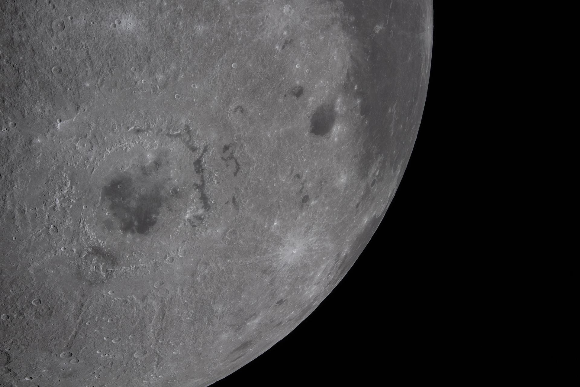 art002e019914 (April 6, 2026) – The Artemis II crew captured this close-up view of the Moon’s southwestern limb during lunar flyby observation operations. The view highlights variations in brightness across the lunar surface and features including Orientale basin, Grimaldi crater, Byrgius A crater, and the western edge of Oceanus Procellarum. Credit: NASA