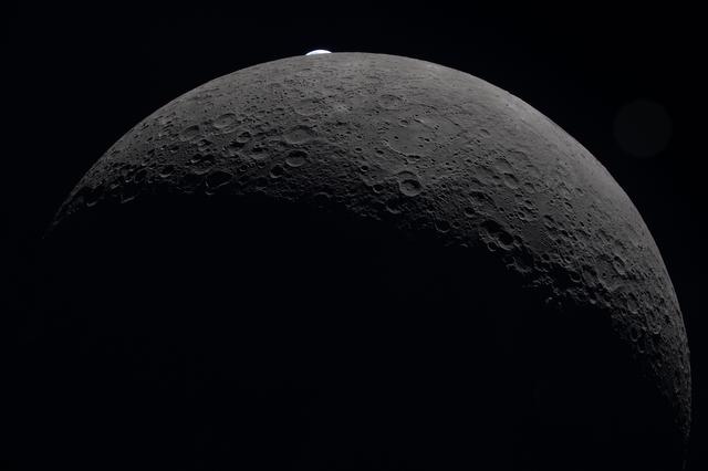As the Artemis II crew flew around the far side of the Moon,...
