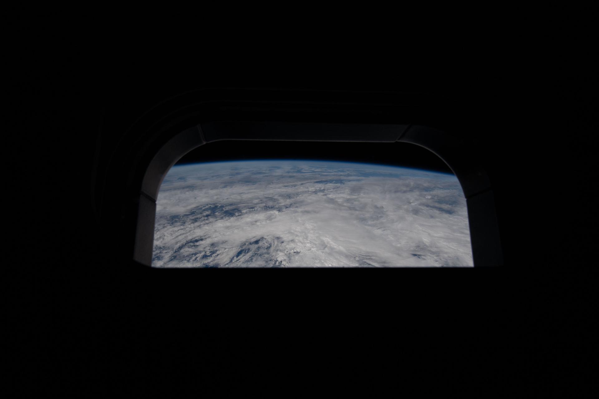 art002e025469 (April 2, 2026) – View out of one of the Orion spacecraft's main cabin windows, looking back at Earth, as the crew travels towards the Moon. Credit: NASA