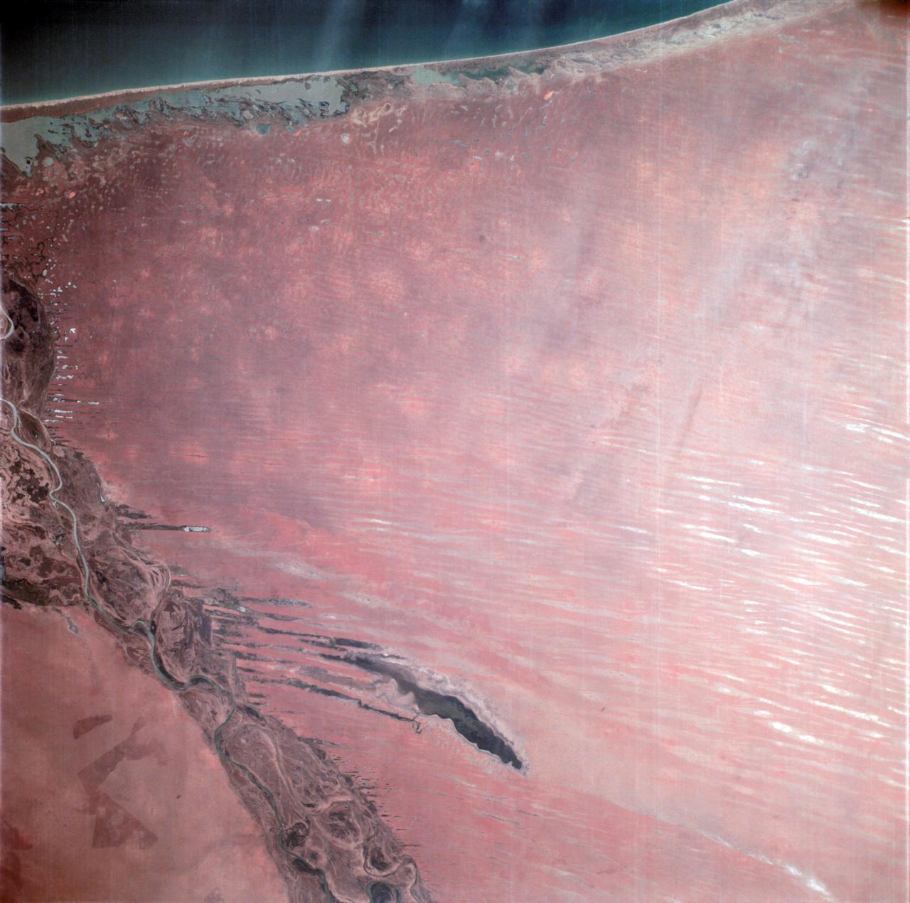 AS06-02-938 (6 April 1968) --- During the second revolution of the National Aeronautics and Space Administration's Apollo 6 spacecraft, this photograph of Senegal and Mauritania was taken at an altitude of 125 nautical miles. The predominant feature is the valley of the Senegal River (flowing to lower right). Lake Rkiz is to the left of the river in Mauritania. The Trarza Scrub Hills, a large area of elongated, fixed dunes, is in the lower left of the print. The land area seen in this photo is approximately 10,000 square miles or about the size of the state of Maryland. The photo was made one hour and fifty minutes after liftoff using a J.A. Maurer model 220G camera with Eastman Kodak SO-121 high resolution aerial Ektachrome film (exposure setting of f: 5.6 at 1/500 sec.).