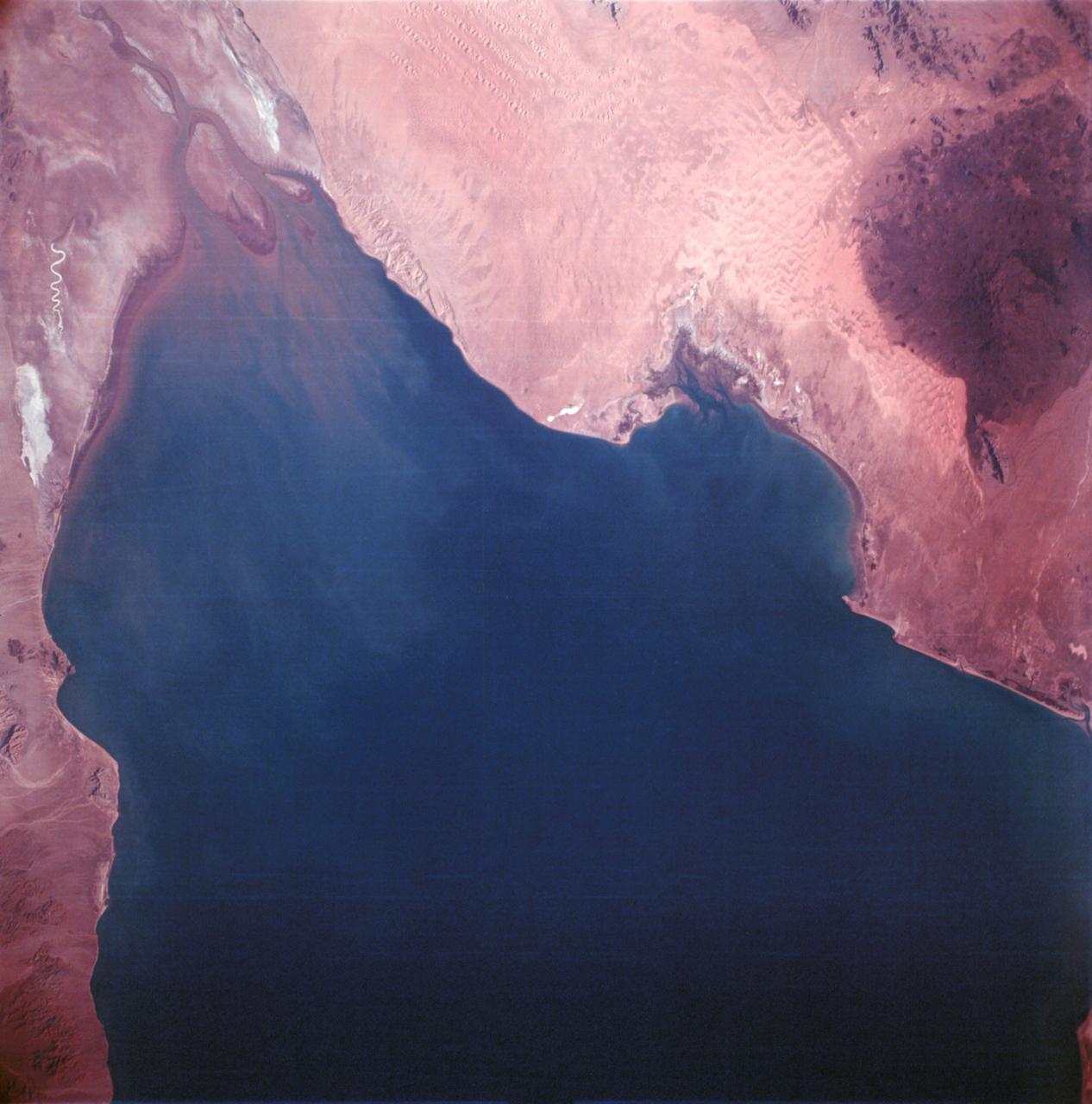 AS06-02-1436 (4 April 1968) --- View of the mouth of the Colorado River and the Gulf of California in northwestern Mexico as photographed from the unmanned Apollo 6 (Spacecraft 020/Saturn 502) space mission. Altitude of the spacecraft at the time picture was taken was 120 nautical miles. NORTH IS TOWARD LEFT SIDE OF PICTURE. At bottom edge of photograph is Baja California. In the upper left corner is the Mexican state of Sonora showing the Sonoran Desert and the Pinacate Mountains. This photograph was made three hours and seven minutes after liftoff using Eastman Kodak SO-121 high resolution aerial Ektachrome film (exposure setting was f/5.6 at 1/500 second) in a J.A. Maurer model 2200 camera.