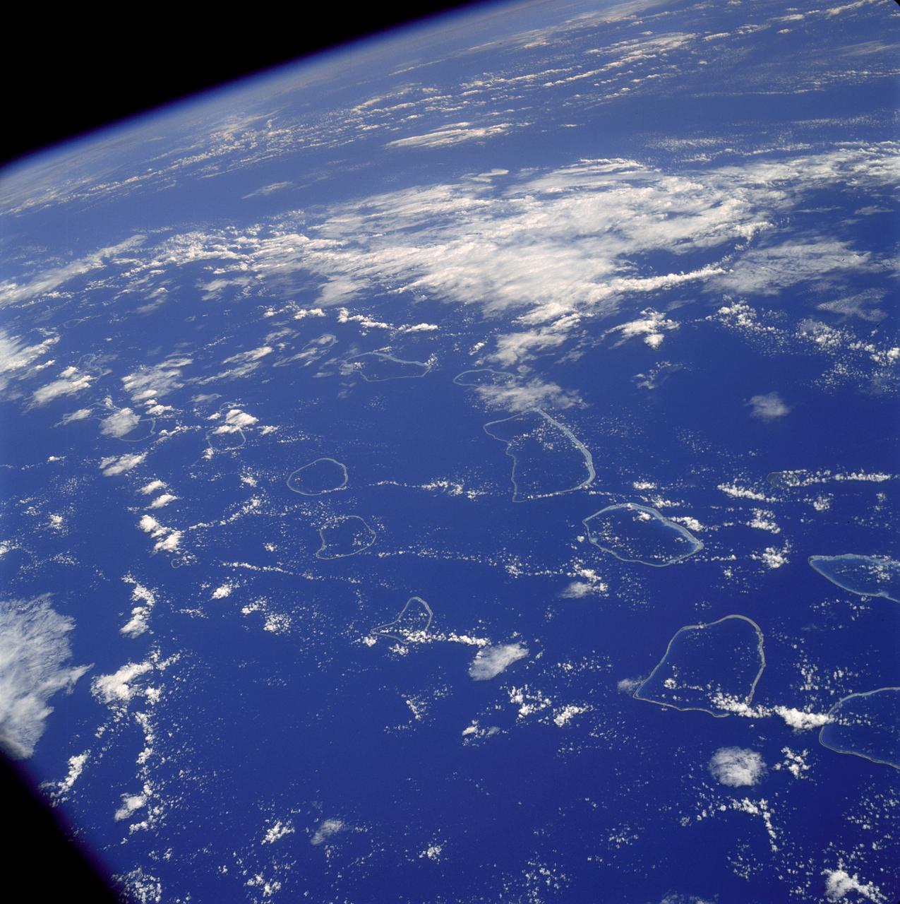 AS07-04-1590 (20 Oct. 1968) --- Tuamotu Archipelago in the South Pacific Ocean, looking southwest, as photographed from the Apollo 7 spacecraft during its 141st revolution of Earth. The photograph was taken from an altitude of 110 nautical miles, at a ground elapsed time of 224 hours and 18 minutes.