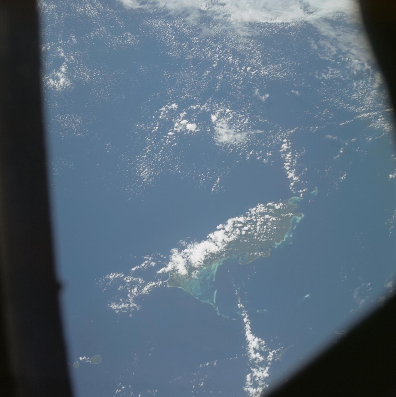 AS07-04-1609 (21 Oct. 1968) --- Woodlark Island in the Solomon Sea, east of New Guinea and northeast of Australia, as seen from the Apollo 7 spacecraft during its 158th revolution of Earth. Photographed from an altitude of 140 nautical miles, at ground elapsed time of 251 hours and 21 minutes.
