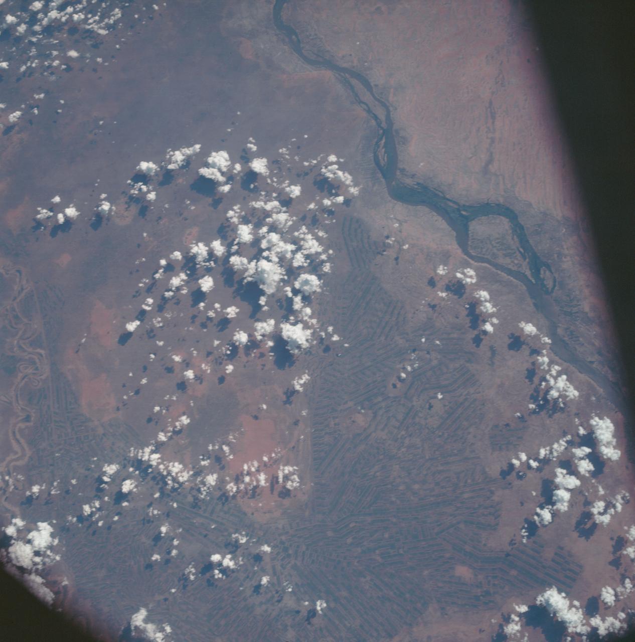 AS7-06-1718 (14 Oct. 1968) --- Sudan, showing White Nile and Blue Nile rivers below Khartoum, as seen from the Apollo 7 spacecraft during its 44th revolution of Earth. Photographed from an altitude of approximately 130 nautical miles, at ground elapsed time of 69 hours and 10 minutes. Note quilted-patchwork effect created by irrigated cultivated land.