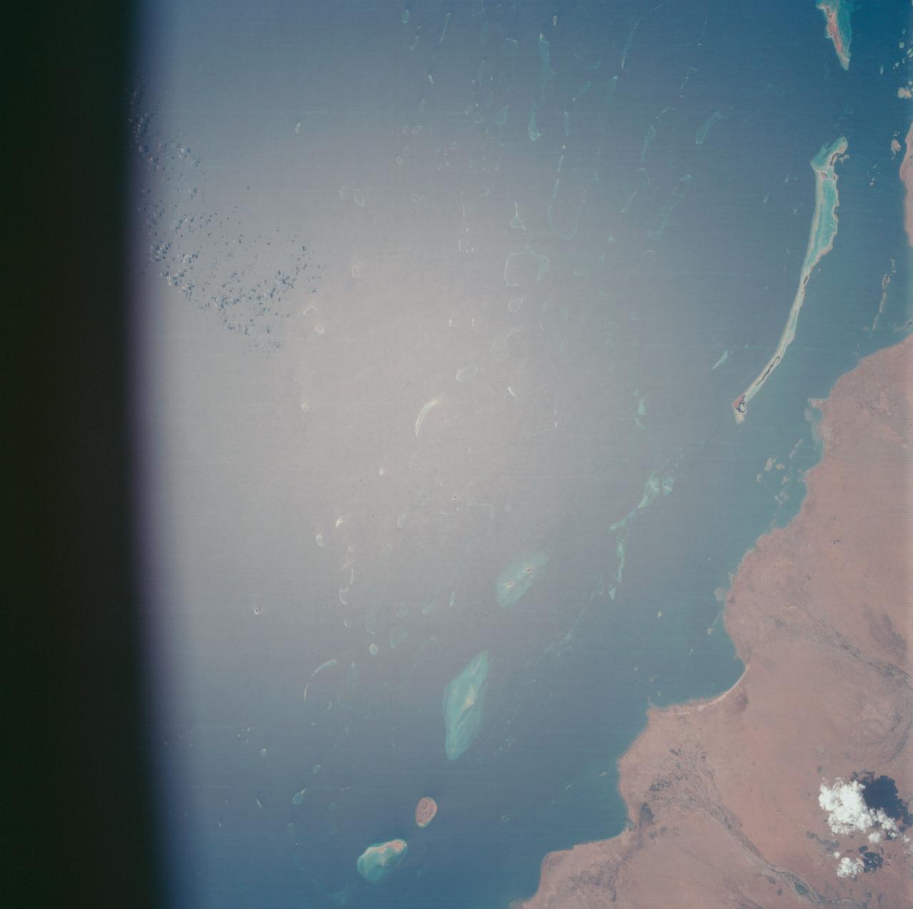 AS07-07-1774 (15 Oct. 1968) --- Red Sea coastal area of Saudi Arabia as seen from the Apollo 7 spacecraft during its 58th revolution of Earth. This picture shows extent of coral reefs in the Red Sea. Photographed from an altitude of 88 nautical miles, at ground elapsed time of 91 hours and 17 minutes.