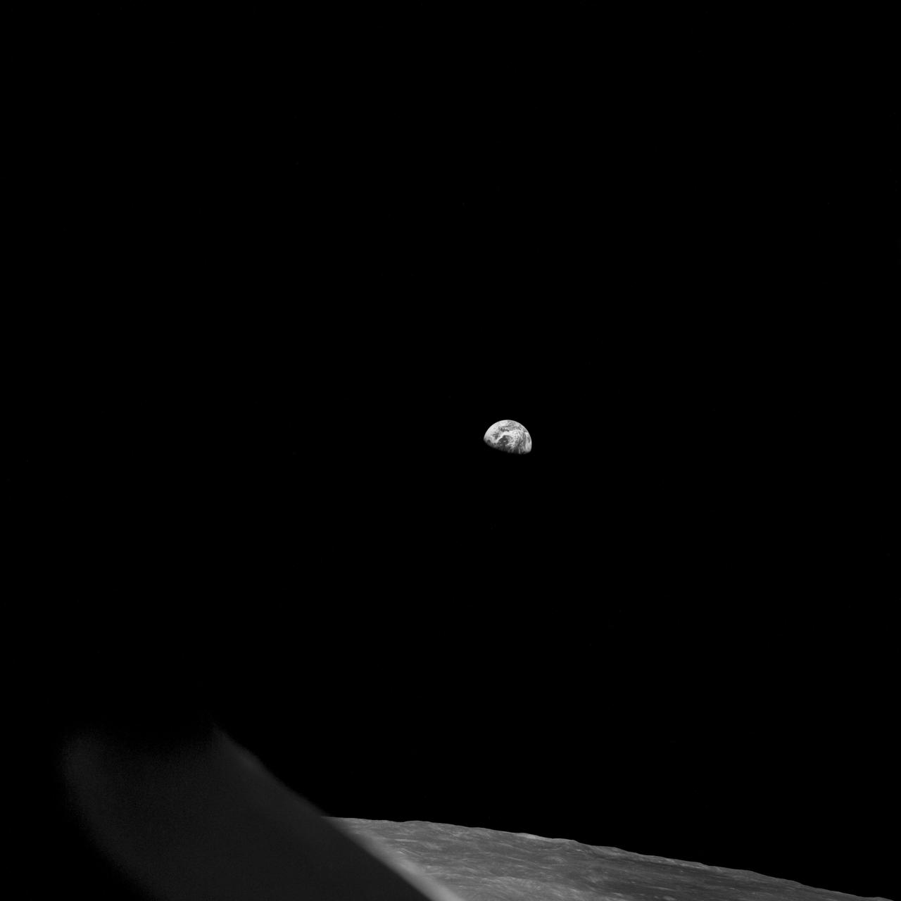Apollo 8,Earth and Lunar Horizon. Image taken on Revolution 10 during Transearth Injection (TEI). Original Film Magazine was labeled D. Camera Data: 70mm Hasselblad. Lens: 80mm; F-Stop: F/11; Shutter Speed: 1/250 second. Film Type: Kodak SO-3400 Black and White,ASA 40. Flight Date: December 21-27,1968. 