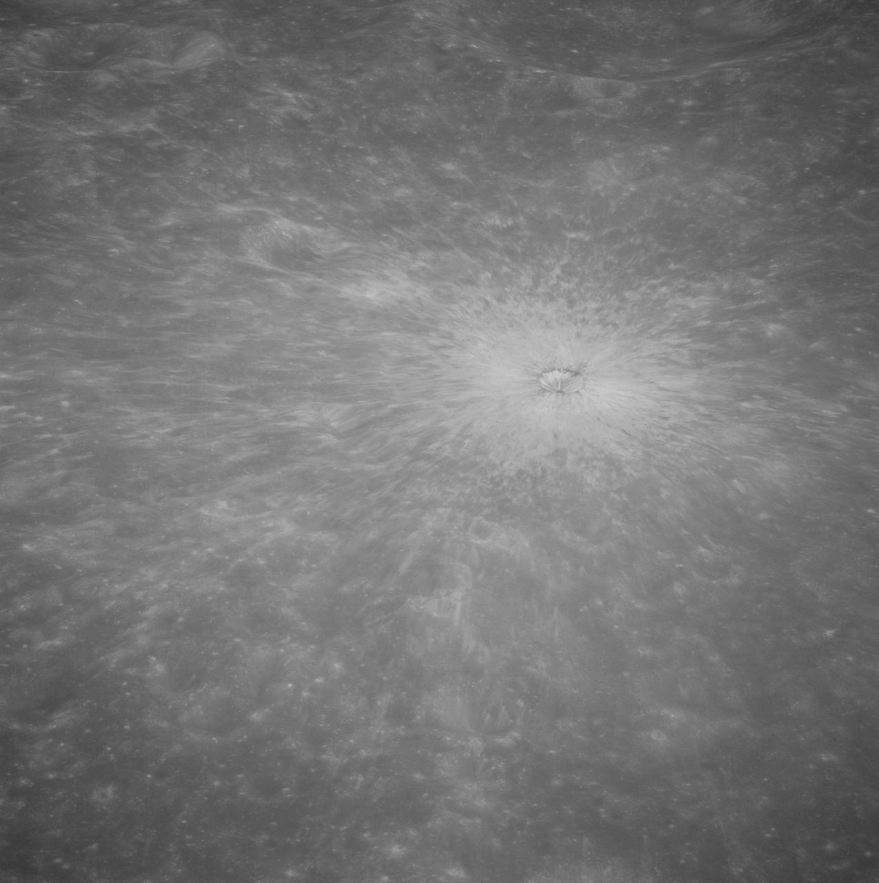AS08-13-2327 (21-27 Dec. 1968) --- A brightly-rayed crater on the farside of the moon near the sub solar point, where the sun was directly overhead, as seen from the Apollo 8 spacecraft. (HOLD PICTURE WITH THE CRATER SLIGHTLY TO THE UPPER RIGHT). Brightly-rayed craters are numerous on the lunar front side; however, they have not been previously observed in such detail on the farside.