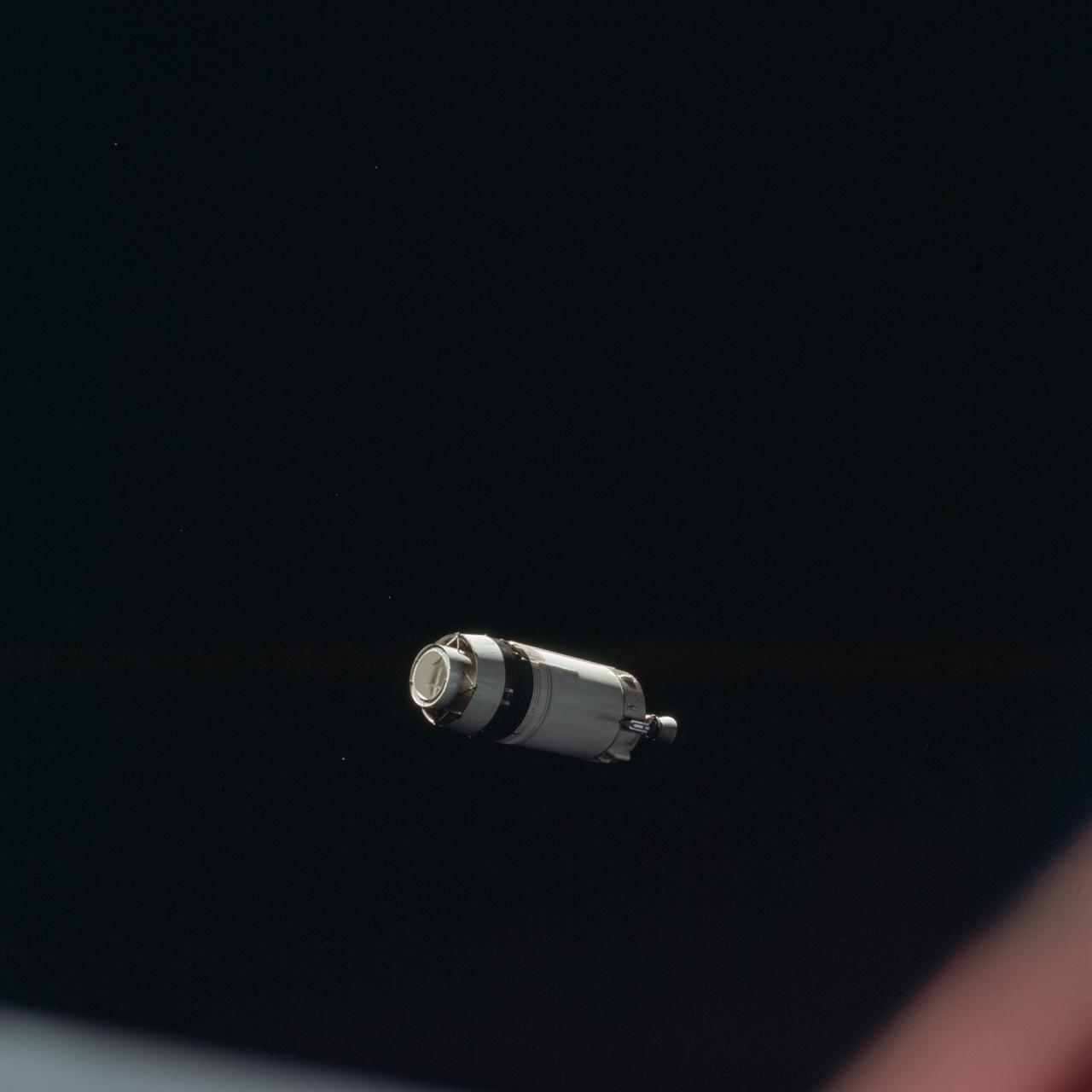 AS08-16-2584 (21 Dec. 1968) --- This is a photograph taken from the Apollo 8 spacecraft looking back at the Saturn V third (S-IVB) stage from which the spacecraft had just separated following trans-lunar injection. Attached to the S-IVB is the Lunar Module Test Article (LTA) which simulated the mass of a Lunar Module (LM) on the Apollo 8 lunar orbit mission. The 29-feet panels of the Spacecraft LM Adapter which enclosed the LTA during launch have already been jettisoned and are out of view. Sunlight reflected from small particles shows the "firefly" phenomenon which was reported by astronaut John H. Glenn Jr. during the first Earth-orbital flight, Mercury-Atlas 6 (MA-6) of the Mercury Program.