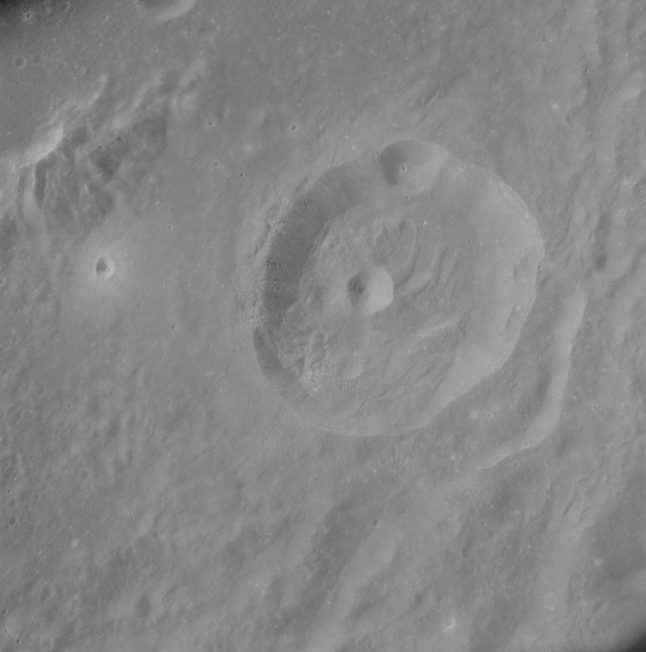 AS8-17-2704 (21-27 Dec. 1968) --- Near vertical view of the lunar farside as photographed from the Apollo 8 spacecraft. This crater, which is about 22 statute miles in diameter, is located at 167 degrees east longitude and 11 degrees south latitude. This crater is located on the eastern edge of a much larger unnamed crater which is about 90 statute miles in diameter.