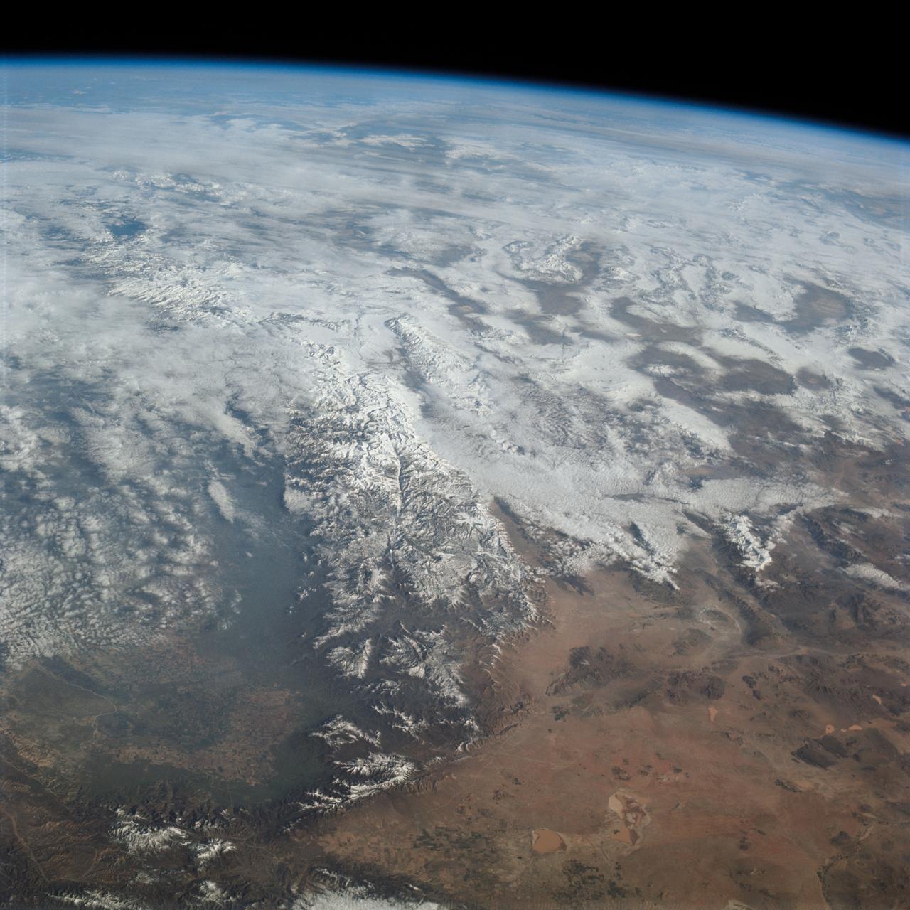 Oblique Earth Observation taken by the Apollo 9 crew. View is of California and includes Sierra Nevada, and the Mojave Desert. Film magazine was E,film type was SO-368 Ektachrome with 0.460 - 0.710 micrometers film / filter transmittance response and haze filter,80mm lens. Latitude was 35.20 N by Longitude 118.10 W, Overlap was 80%, Altitude miles were 130 and cloud cover was 20%.