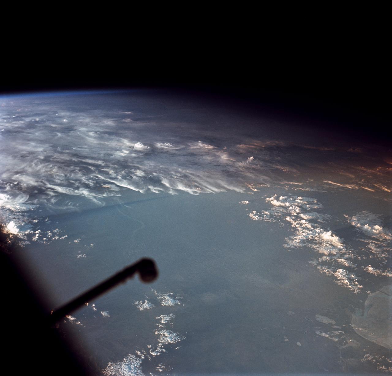 Oblique Earth Observation taken by the Apollo 9 crew. View is of southwest Africa near Cape Fria. Film magazine was E,film type was SO-368 Ektachrome with 0.460 - 0.710 micrometers film / filter transmittance response and haze filter,80mm lens. Latitude was 21.15 S by Longitude 12.40 E, Overlap was 80%, Altitude miles were 163 and cloud cover was 40%. 