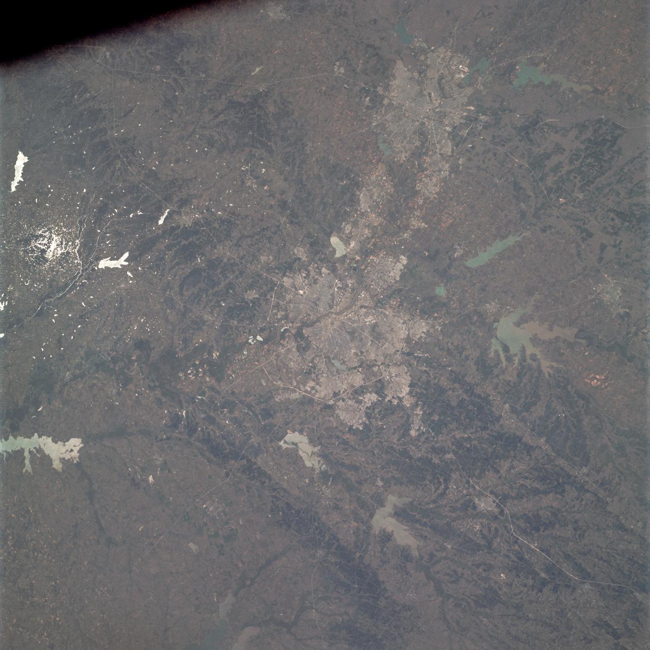 AS09-21-3299 (3-13 March 1969) --- Dallas-Fort Worth area as photographed from the Apollo 9 spacecraft during its Earth-orbital mission. The superhighways leading out of two cities are clearly visible. The largest body of water north of Dallas is the Garza-Little Elm Reservoir. Cedar Creek Reservoir is located to the southeast of Dallas. The City of Denton is near left center edge of picture at junction of two highways leading from Fort Worth and Dallas.
