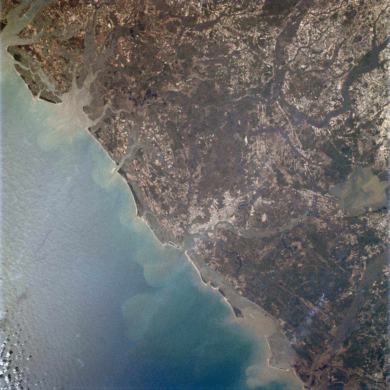 AS09-23-3568 (3-13 March 1969) --- Atlantic coast of South Carolina as photographed from the Apollo 9 spacecraft during its Earth-orbital mission. The visible coastline extends from the mouth of the Savannah River northeastward to the mouth of the Santee River. The city of Charleston is on the coast in the center of picture. Lake Moultrie is at left center edge of picture.