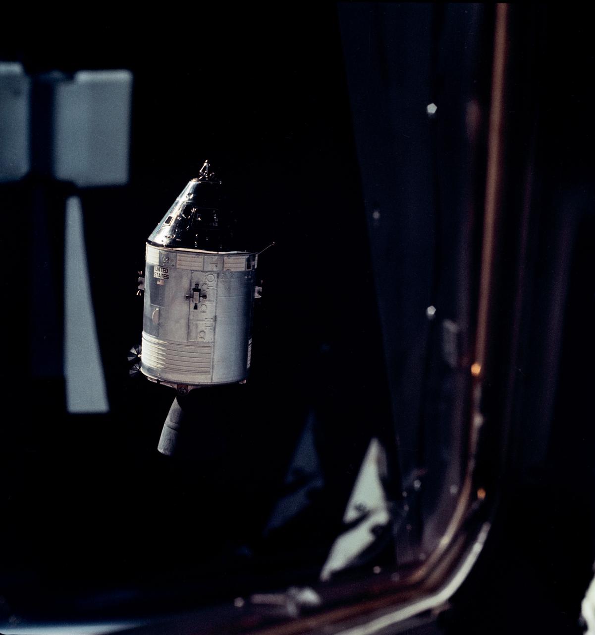 The Apollo 9 Command/Service Modules photographed through the window from the Lunar Module,"Spider",on the fifth day of the Apollo 9 earth-orbital mission. Docking mechanism is visible in nose of the Command Module,"Gumdrop". Film magazine was F, film type was SO-368 Ektachrome with 0.460 - 0.710 micrometers film / filter transmittance response and haze filter,80mm lens