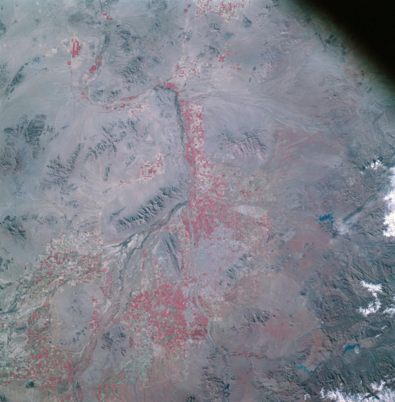 AS09-26A-3801A (12 March 1969) --- Colored infrared photograph of the Phoenix, Arizona area, taken on March 12, 1969, by one of the four synchronized cameras of the Apollo 9 Earth Resources Survey (SO65) Experiment. At 11:28 a.m. (EST) when this picture was made the Apollo 9 spacecraft was at an altitude of 127 nautical miles, and the sun elevation was 32 degrees above the horizon. The location of the point on Earth's surface at which the four-camera combination was aimed was 33 degrees 25 minutes north latitude, and 112 degrees 18 minutes west longitude. The other three cameras used: (B) black and white film with a red filter; (C) black and white infrared film; and (D) black and white film with a green filter.