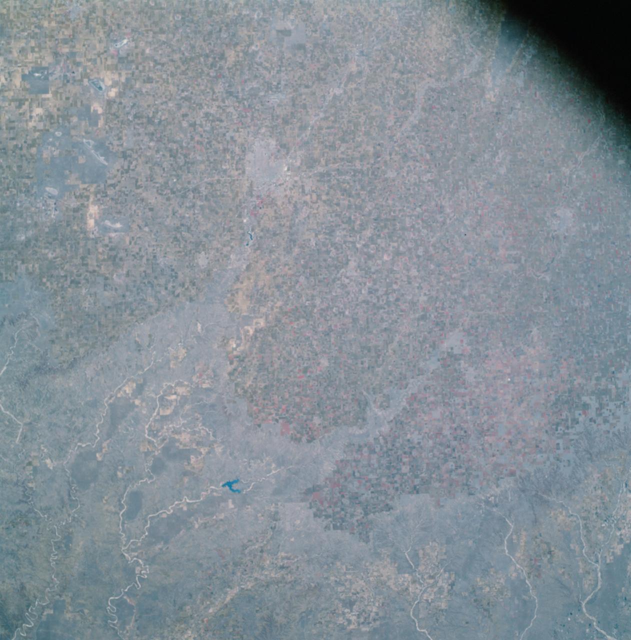 AS09-26A-3808A (12 March 1969) --- Color infrared photograph of the Lubbock, Texas area, taken on March 12, 1969, by one of the four synchronized cameras of the Apollo 9 Earth Resources Survey SO65 Experiment. At 11:31 a.m. (EST) when this picture was made the Apollo 9 spacecraft was at an altitude of 117 nautical miles, and the sun elevation was 38 degrees above the horizon. The location of the point on the surface of Earth at which the four-camera combination was aimed was 33 degrees 41 minutes north latitude, and 101 degrees 29 minutes west longitude. The other three cameras used: (B) black and white film with a red filter; (C) black and white infrared film; and (D) black and white film with a green filter.