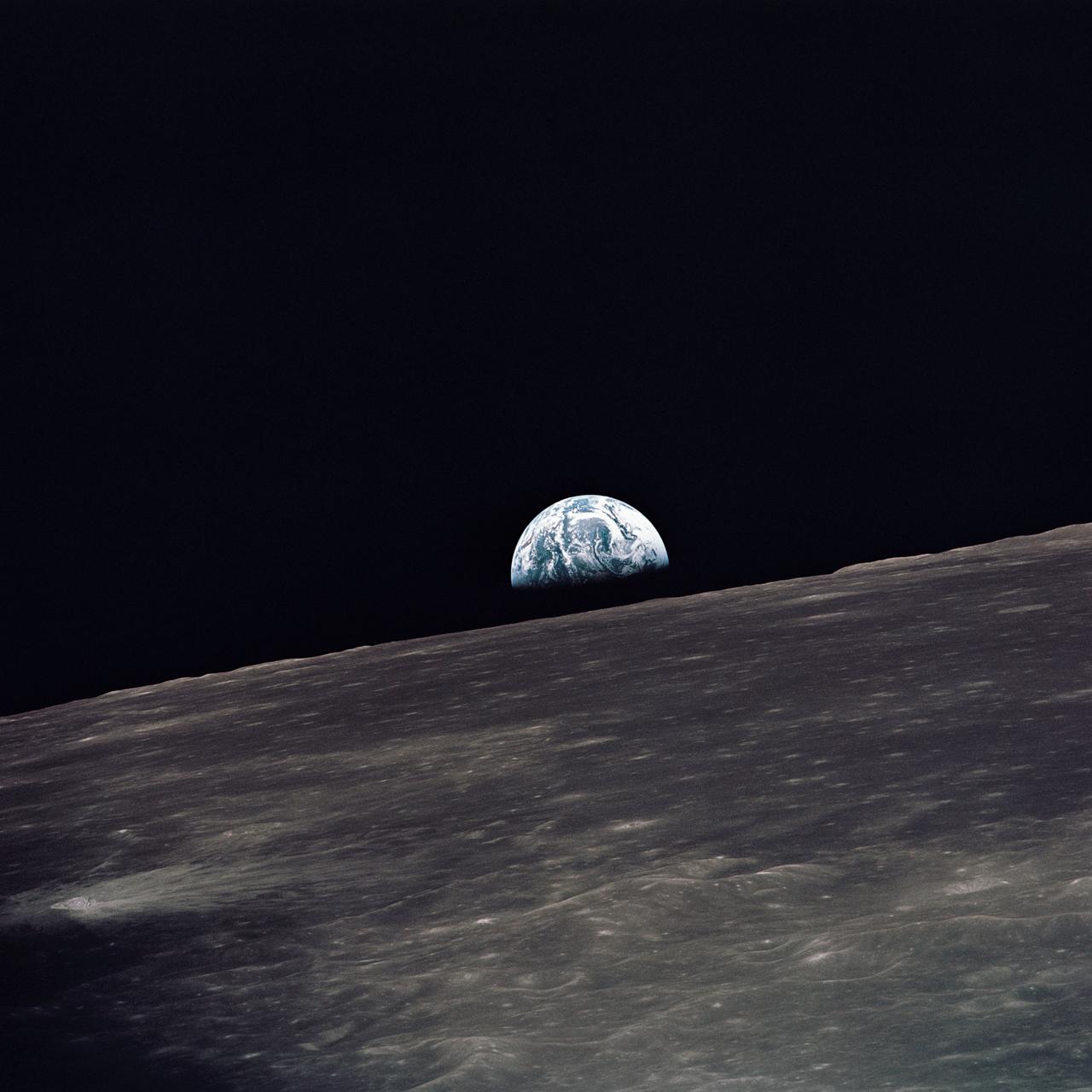 AS10-27-3890 (18-26 May 1969) --- A view of Earth rising above the lunar horizon photographed from the Apollo 10 Lunar Module, looking west in the direction of travel. The Lunar Module at the time the picture was taken was located above the lunar farside highlands at approximately 105 degrees east longitude.