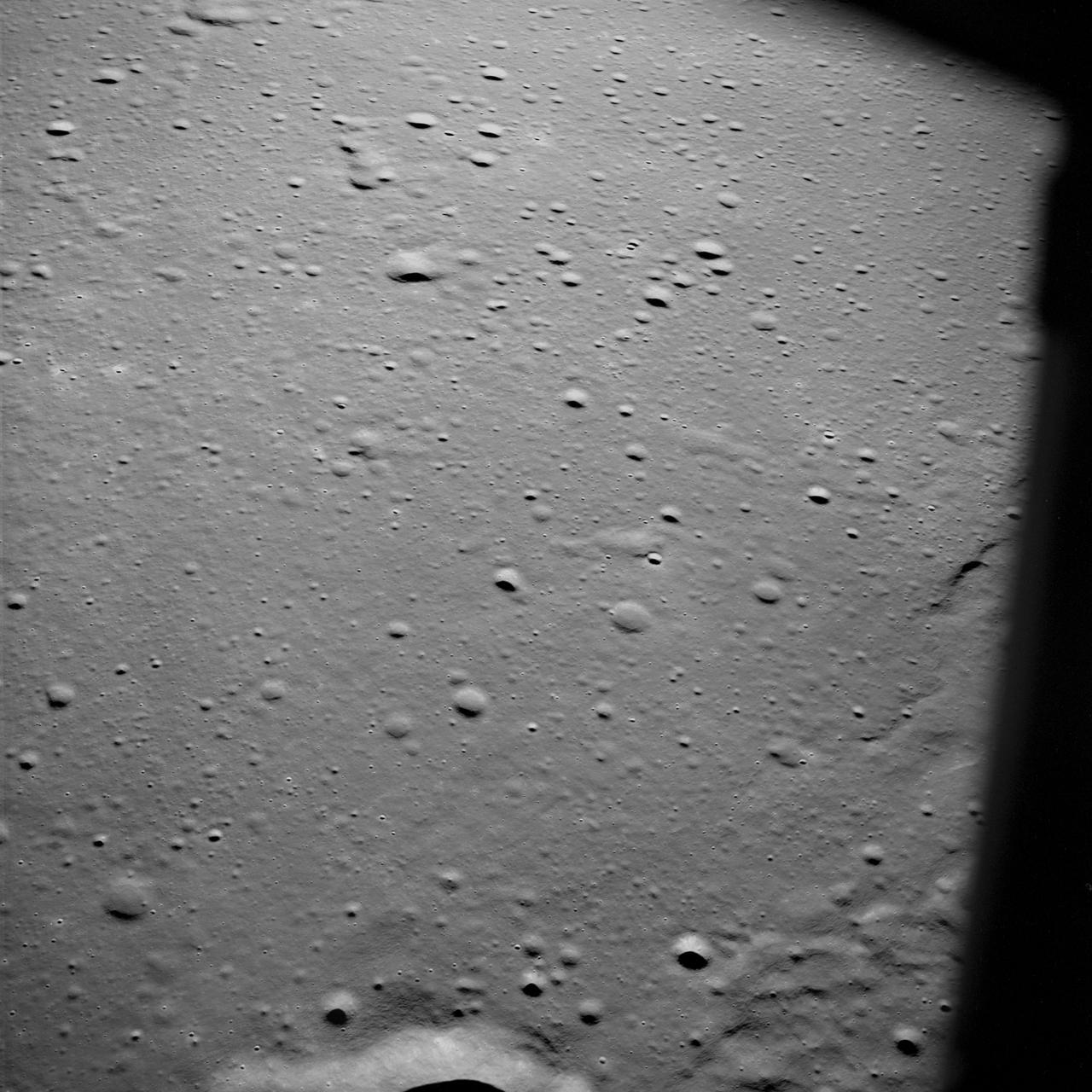 AS10-29-4321 (18-26 May 1969) --- An Apollo 10 oblique view of the western portion of the Sea of Tranquility. The area in the picture is located approximately 70 nautical miles east-southeast of Apollo Landing Site 2. The flat terrain pitted by moderate-sized craters is typical of this portion of Mare Tranquillitatis.