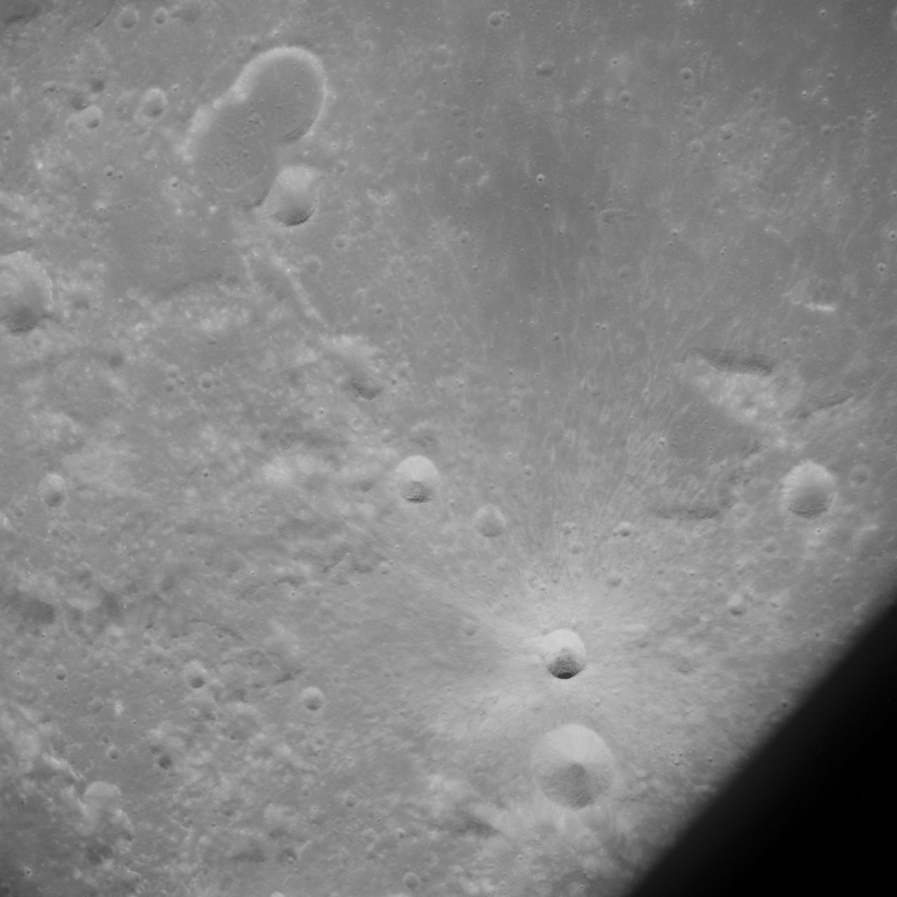 AS10-32-4845 (18-26 May 1969) --- An Apollo 10 southwest oblique view of the crater Censorinus which is located in the highland terrain bordering the Sea of Tranquility. HOLD PICUTRE WITH WINDOW FRAME AT LOWER LEFT. Censorinus is the bright crater in the lower left of the photograph. Censorinus is about 5 kilometers (about 3 statute miles) in diameter. Immediately to the left of Censorinus is the larger crater Censorinus A. The Sea of Tranquility is to the lower right of the photograph, which was taken from the Command and Service Modules. Censorinus is one of the brighter craters on the lunar surface.