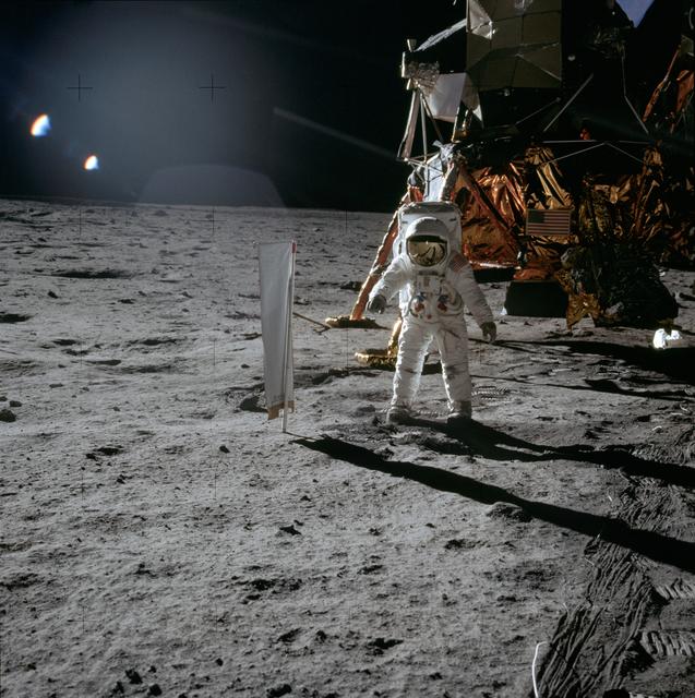 NASA image: Apollo 11 Mission image - Astronaut Edwin Aldrin stands beside t