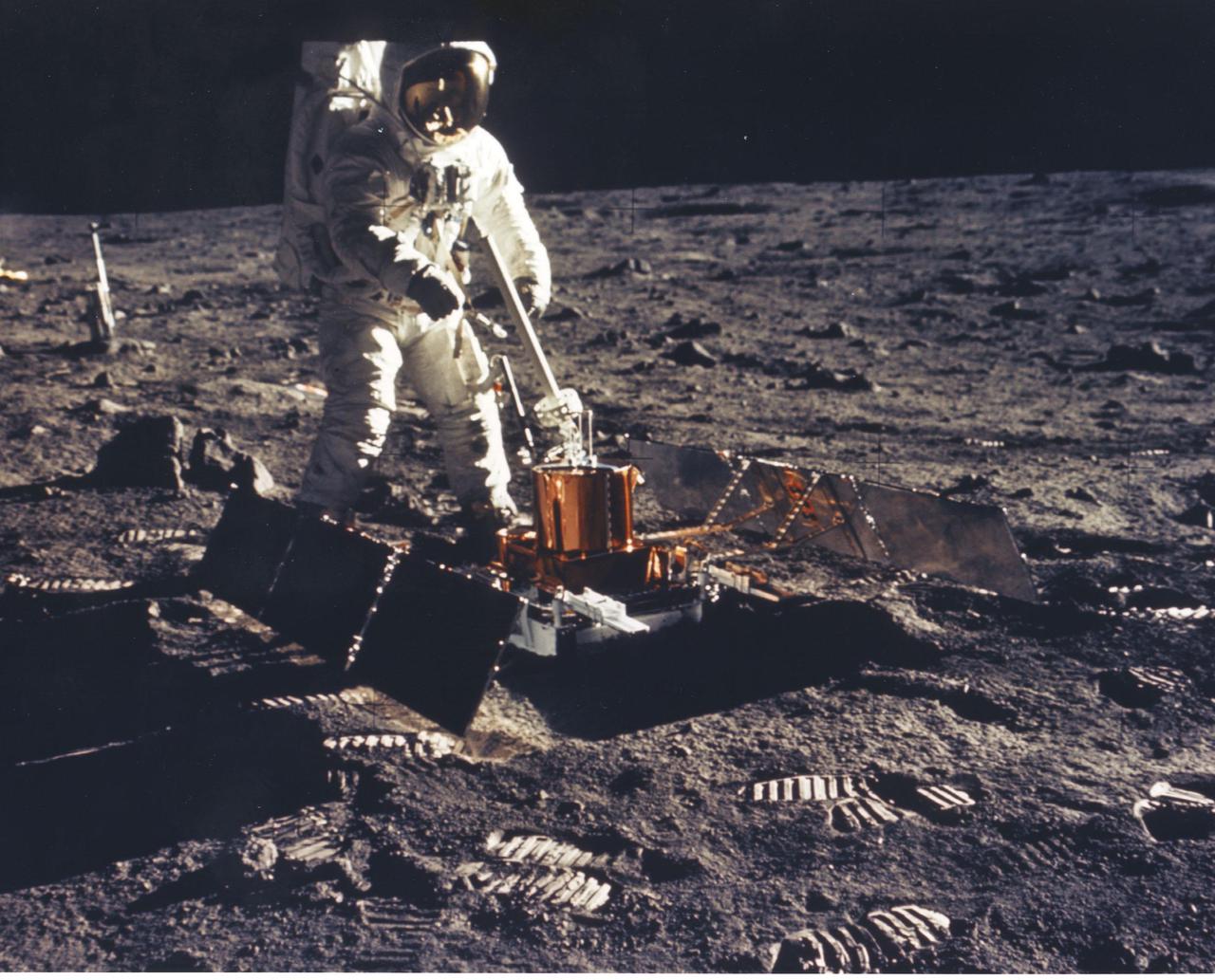 JOHNSON SPACE CENTER, HOUSTON, TEXAS  - Apollo 11 Lunar Module Pilot Edwin E. Aldrin Jr. deployes the Passive Seismic Experiment Package (PSE) on the Moon's surface near Tranquility Base.  The sensitive instrument remained behind on the lunar surface to radio back information concerning moonquakes, landslides and meteorite impacts.