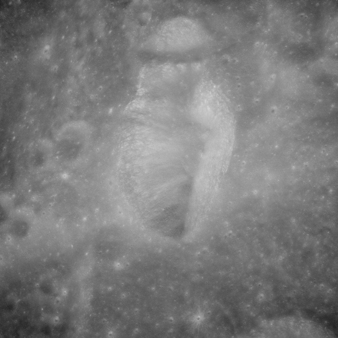 AS11-43-6422 (July 1969) --- An Apollo 11 oblique view of the lunar farside.  These two odd-shaped craters are located midway between International Astronomical Union craters 218 and 220, and are centered at 155 degrees east longitude and 3 degrees north latitude.  The craters total approximately 13.5 statute miles in length and 7.5 statute miles in width at their widest point.