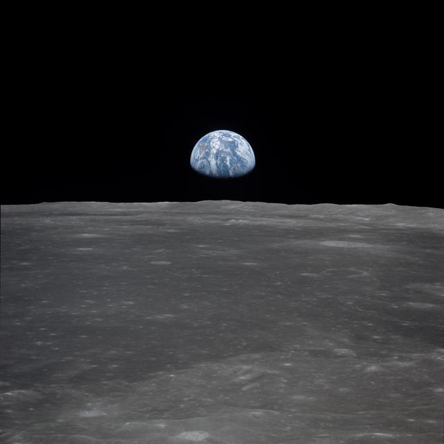 NASA image: Apollo 11 Mission image - View of moon limb, with Earth on the horizon