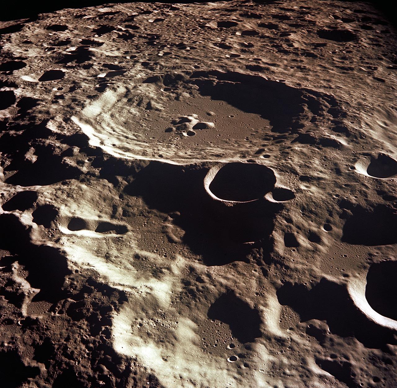 AS11-44-6609 (16-24 July 1969) --- An oblique of the Crater Daedalus on the lunar farside as seen from the Apollo 11 spacecraft in lunar orbit. The view looks southwest. Daedalus (formerly referred to as I.A.U. Crater No. 308) is located at 179 degrees east longitude and 5.5 degrees south latitude. Daedalus has a diameter of about 50 statute miles. This is a typical scene showing the rugged terrain on the farside of the moon. While astronauts Neil A. Armstrong, commander, and Edwin E. Aldrin Jr., lunar module pilot, descended in the Lunar Module (LM) "Eagle" to explore the Sea of Tranquility region of the moon, astronaut Michael Collins, command module pilot, remained with the Command and Service Modules (CSM) "Columbia" in lunar orbit.
