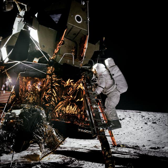 NASA image: Apollo 12 Mission image - Dark view of Astronaut Alan L. Bean climbing down the ladder of the Lunar Module (LM)