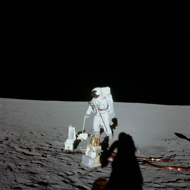 Astronaut Alan Bean deploys ALSEP during first Apollo 12 EVA on moon