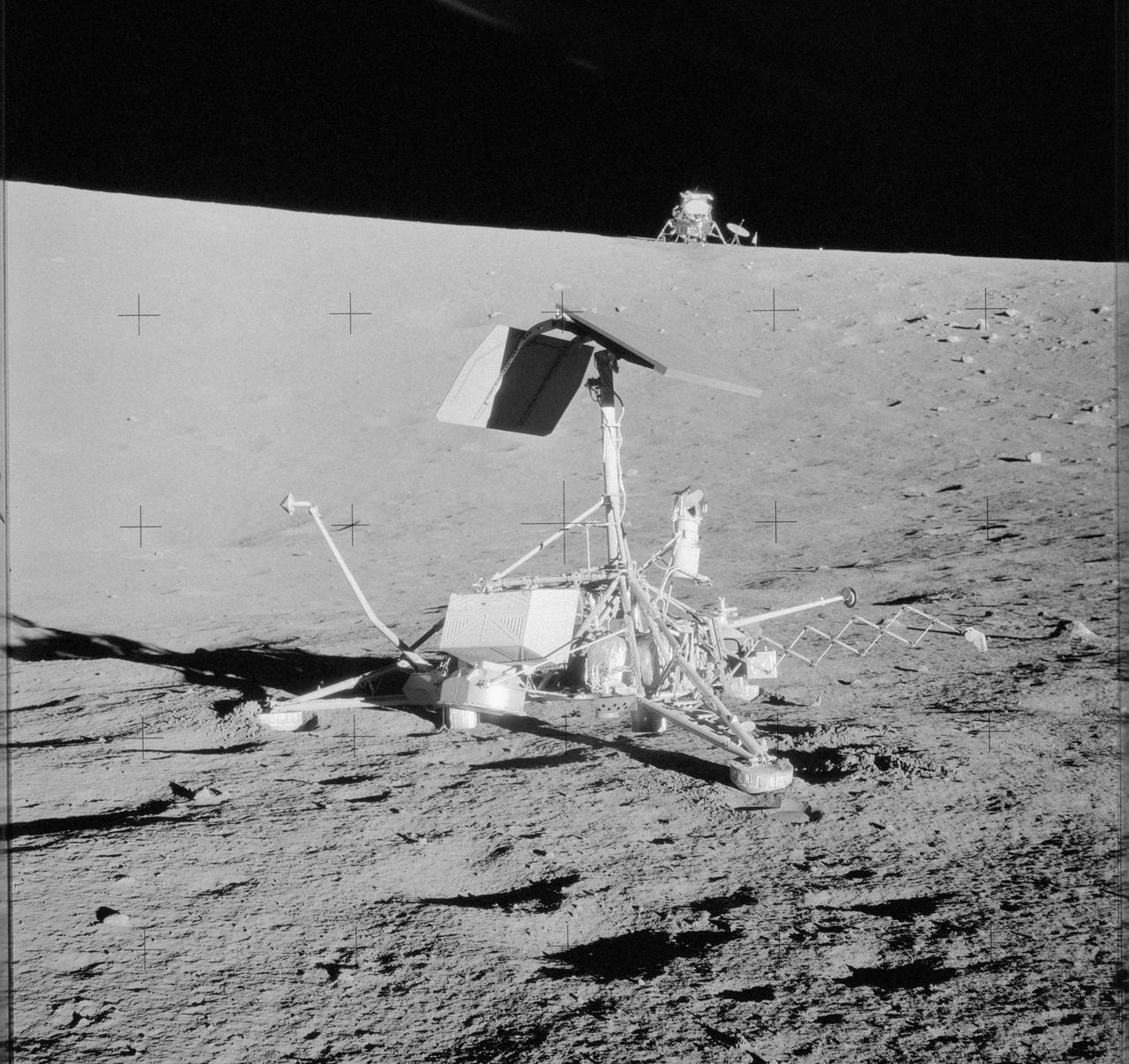 AS12-48-7099 (20 Nov. 1969) --- This unusual view shows two National Aeronautics and Space Administration (NASA) spacecraft on the surface of the moon. In the center foreground is the unmanned Surveyor 3 spacecraft, which soft landed on the lunar surface on April 19, 1967. Just 600 feet away from the Surveyor 3 spacecraft, pictured here in the background, is the Apollo 12 Lunar Module (LM), which landed on the lunar surface on Nov. 19, 1969. This photograph was taken the following day, during the second Apollo 12 extravehicular activity (EVA) in which astronauts Charles Conrad Jr., commander, and Alan L. Bean, lunar module pilot, participated. Pictured to the right of the LM are the deployed S-Band antenna and the United States flag, which was unfurled on Nov. 19, 1969. While Conrad and Bean descended from lunar orbit in their Apollo 12 LM, astronaut Richard F. Gordon Jr., command module pilot, remained with the Command and Service Modules (CSM).