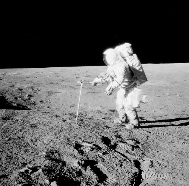 NASA image: Astronaut Alan Bean drives core sample tube into lunar surface
