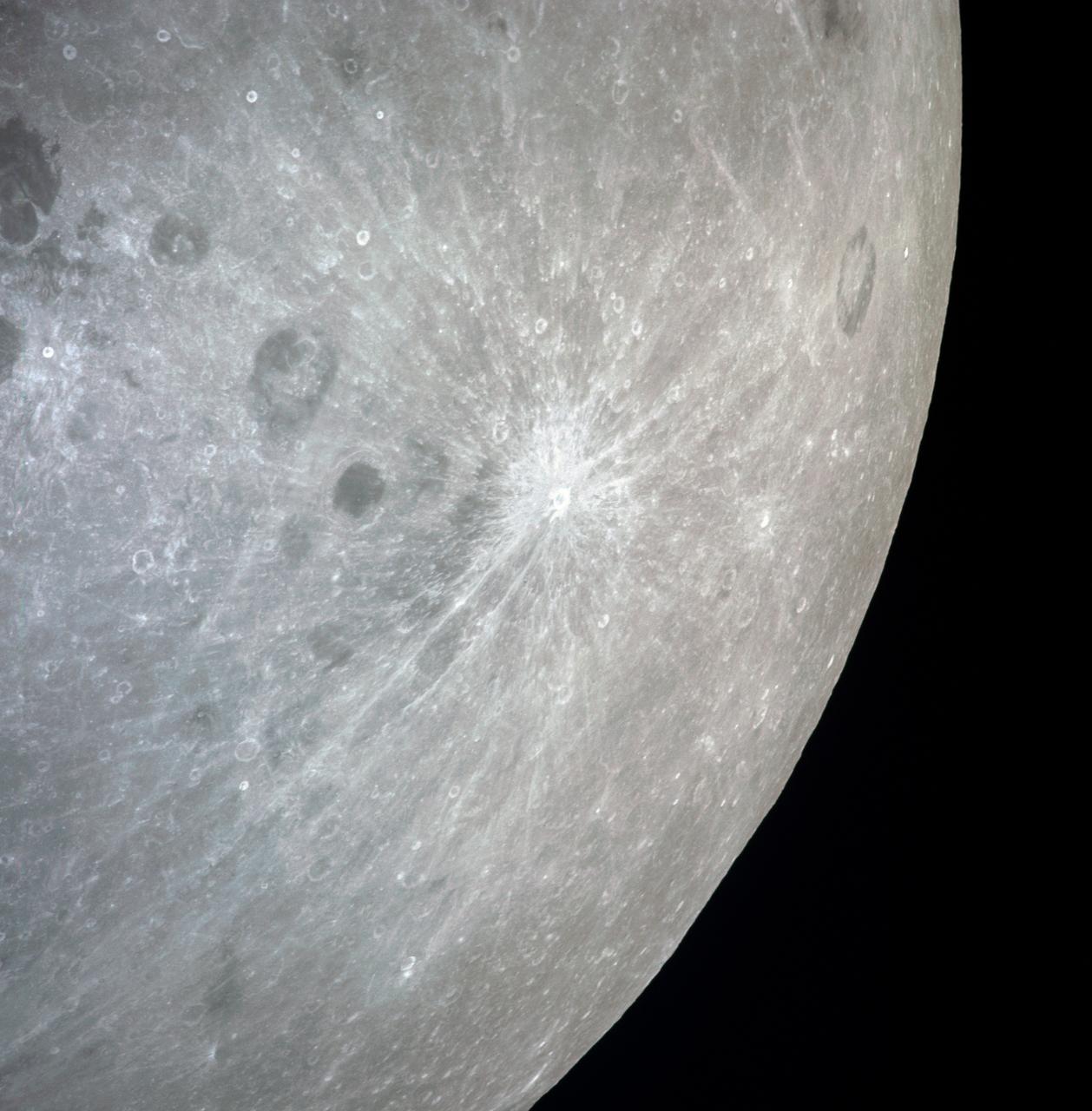 AS13-60-8675 (April 1970) --- This bright-rayed crater on the lunar farside was photographed from the Apollo 13 spacecraft during its pass around the moon. This area is northeast of Mare Marginus. The bright-rayed crater is located at about 105 degrees east longitude and 45 degrees north latitude. The crater Joliot-Curie is located between Mare Marginus and the rayed crater. This view is looking generally toward the northeast.