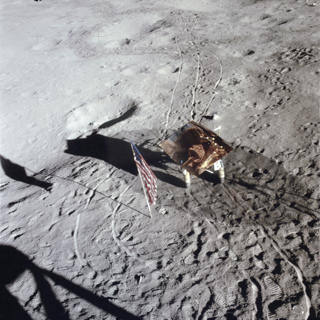 NASA image: U.S. flag, footprints and portable work bench on lunar surface