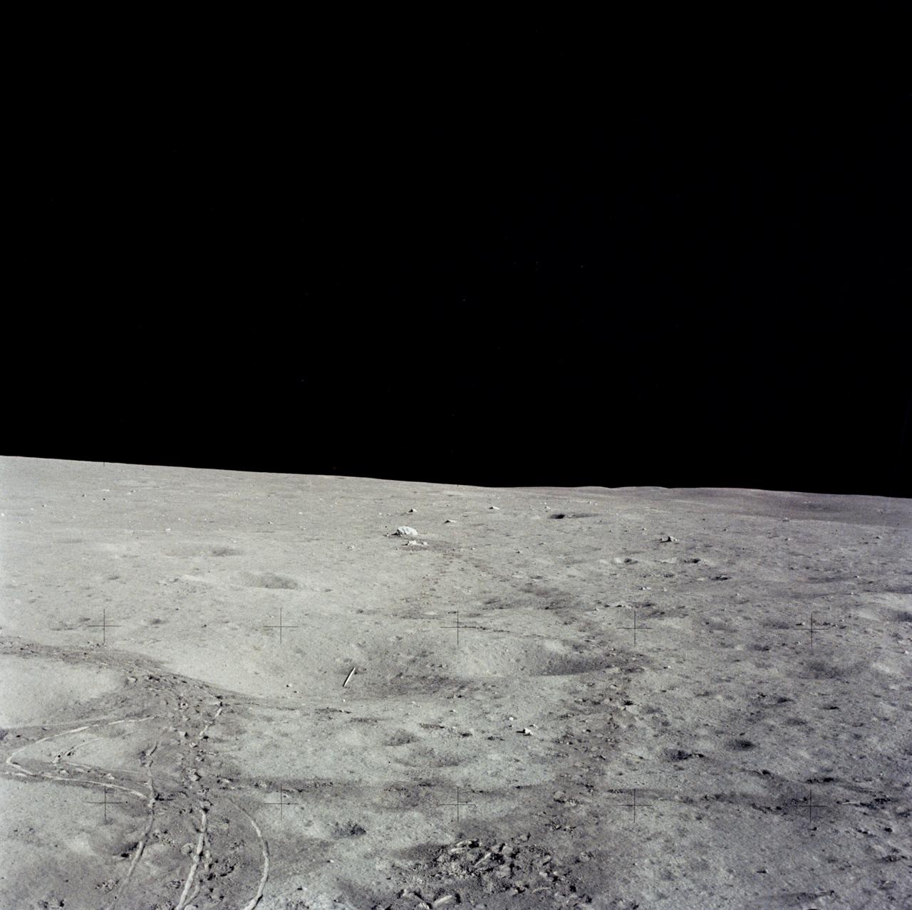 AS14-66-9337 (6 Feb. 1971) --- This view shows the "javelin" and golf ball used by astronaut Alan B. Shepard Jr., commander, during the mission's second extravehicular activity (EVA) on Feb. 6, 1971. Just to the left of center lies the "javelin", with the golf ball just below it, almost perpendicular to it. Dark colored trails are the results of tracks made by the lunar overshoes of the astronauts and the wheels of the modular equipment transporter (MET). This photograph was made through the right window of the Lunar Module (LM), looking northwest.