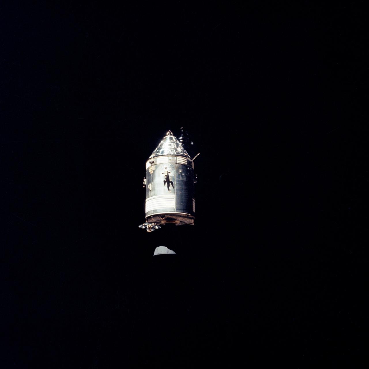 AS14-66-9344 (February 1971) --- The Apollo Command and Service Modules (CSM) are photographed against a black sky background from the Lunar Module (LM) above the moon. While astronauts Alan B. Shepard Jr., commander, and Edgar D. Mitchell, lunar module pilot, descended in the LM "Antares" to explore the Fra Mauro region of the moon, astronaut Stuart A. Roosa , command module pilot, remained with the CSM "Kitty Hawk" in lunar orbit.
