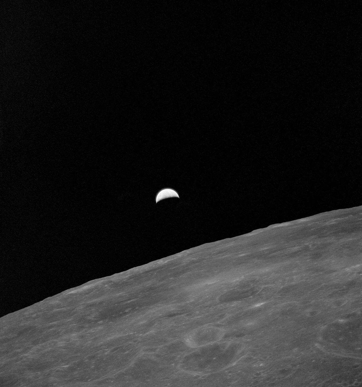AS15-99-13445 (31 July 1971) --- This ultra violet picture of Earth rising over the lunar surface was taken from the Command Module (CM) Endeavor during the 24th revolution of the moon. Astronaut Alfred M. Worden Jr., Apollo 15 command module pilot, remained with the Command and Service Modules (CSM) in lunar orbit while astronauts David R. Scott, commander, and James B. Irwin, lunar module pilot, descended in the Lunar Module (LM) to explore the Hadley-Apennine area of the moon.  Photo credit: NASA