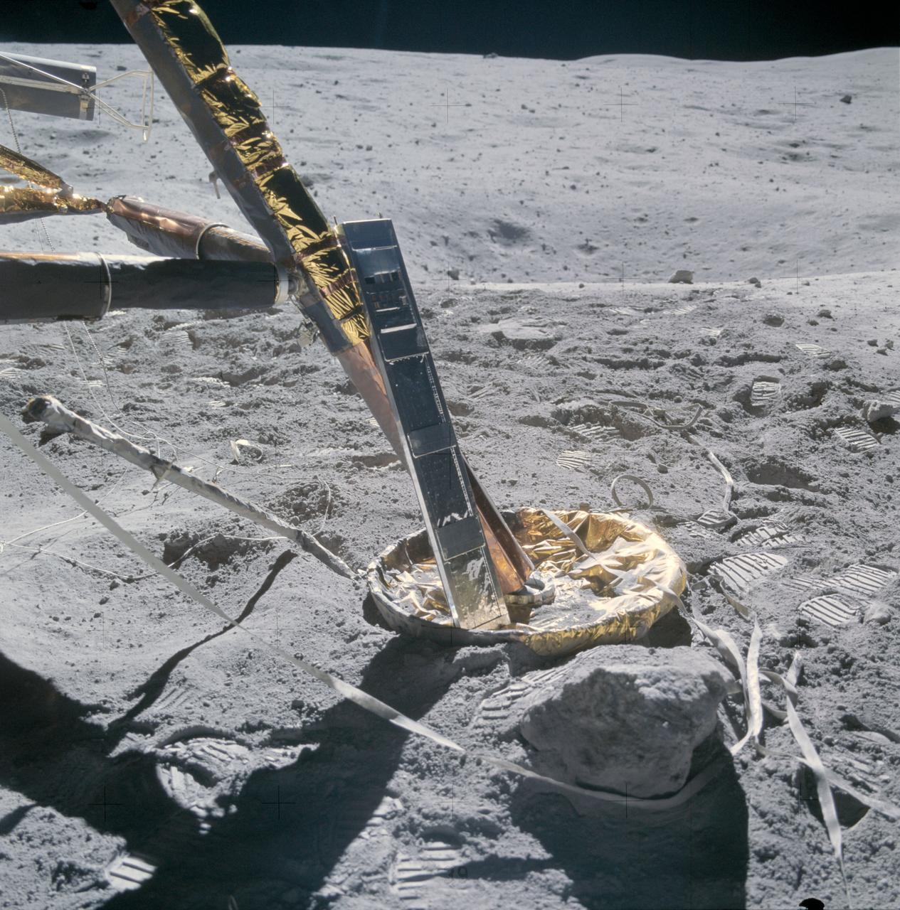 AS16-107-17442 (22 April 1972) --- A close-up view of the Apollo 16 Cosmic Ray Detector (CRD) experiment deployed at the +Y strut of the Lunar Module (LM). The crewmembers moved it to this position from near the deployment site of the Apollo Lunar Surface Experiments Package (ALSEP) because, in the words of astronaut John W. Young, commander, "The panels were getting a little warm." Note that the LM did not skid upon landing, as evidenced by the landing contact probe's folded back (neatly) position and the lack of skid marks. While astronauts Young, and Charles M. Duke Jr., lunar module pilot; descended in the Apollo 16 Lunar Module (LM) "Orion" to explore the Descartes highlands landing site on the moon, astronaut Thomas K. Mattingly II, command module pilot, remained with the Command and Service Modules (CSM) "Casper" in lunar orbit.