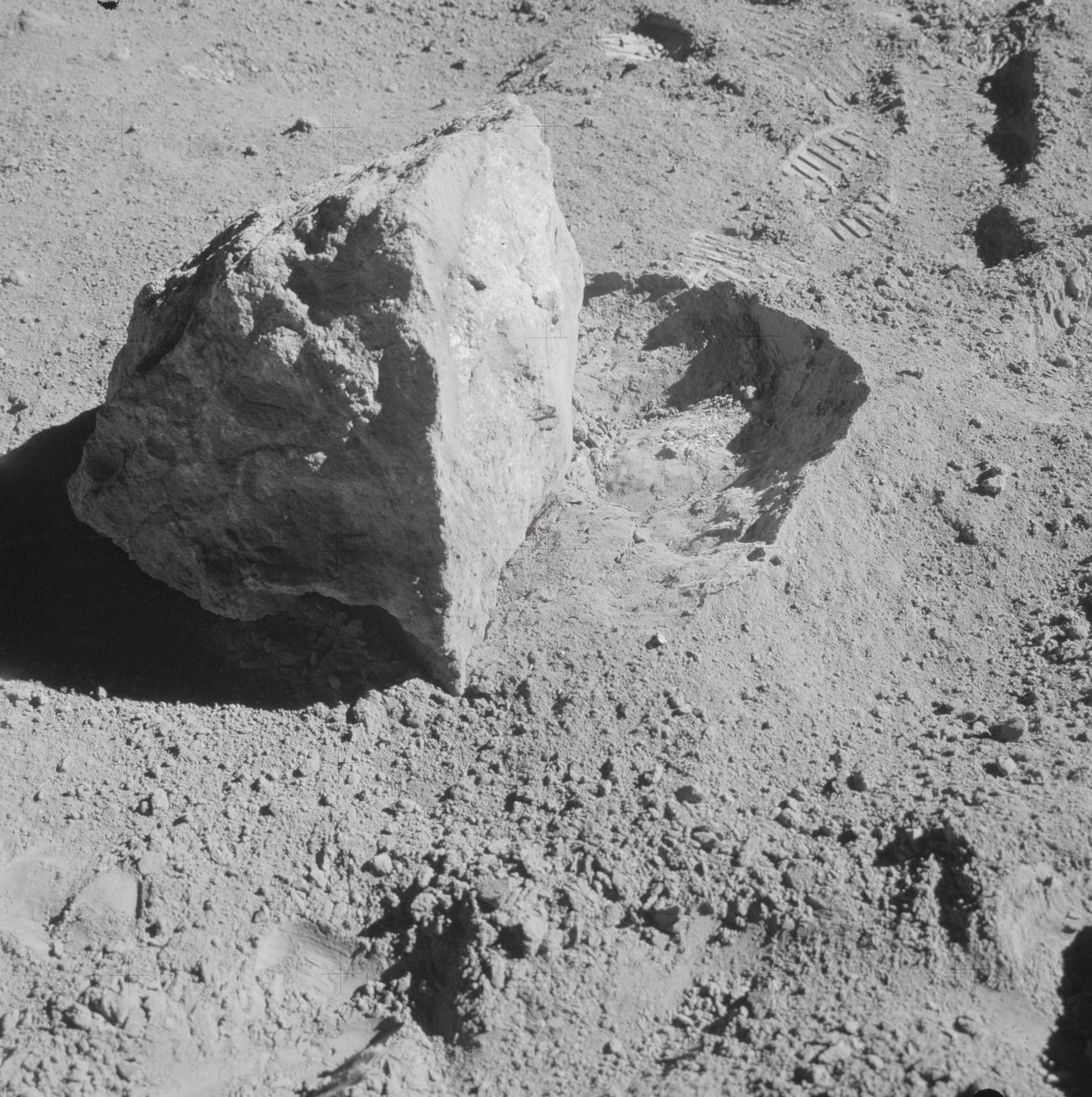 AS16-107-17573 (22 April 1972) --- A close-up view of a block (about 1/2 meter long) found by the two moon-exploring crewmembers of the Apollo 16 lunar landing mission. The block had been rolled over only moments earlier during this Apollo 16 second extravehicular activity (EVA) near South Ray Crater. Astronaut John W. Young, commander, said at the post-mission press conference, "The block has been sitting there evidently since South Ray Crater was formed." While astronauts Young and Charles M. Duke Jr., lunar module pilot; descended in the Apollo 16 Lunar Module (LM) "Orion" to explore the Descartes highlands landing site on the moon, astronaut Thomas K. Mattingly II, command module pilot, remained with the Command and Service Modules (CSM) "Casper" in lunar orbit.