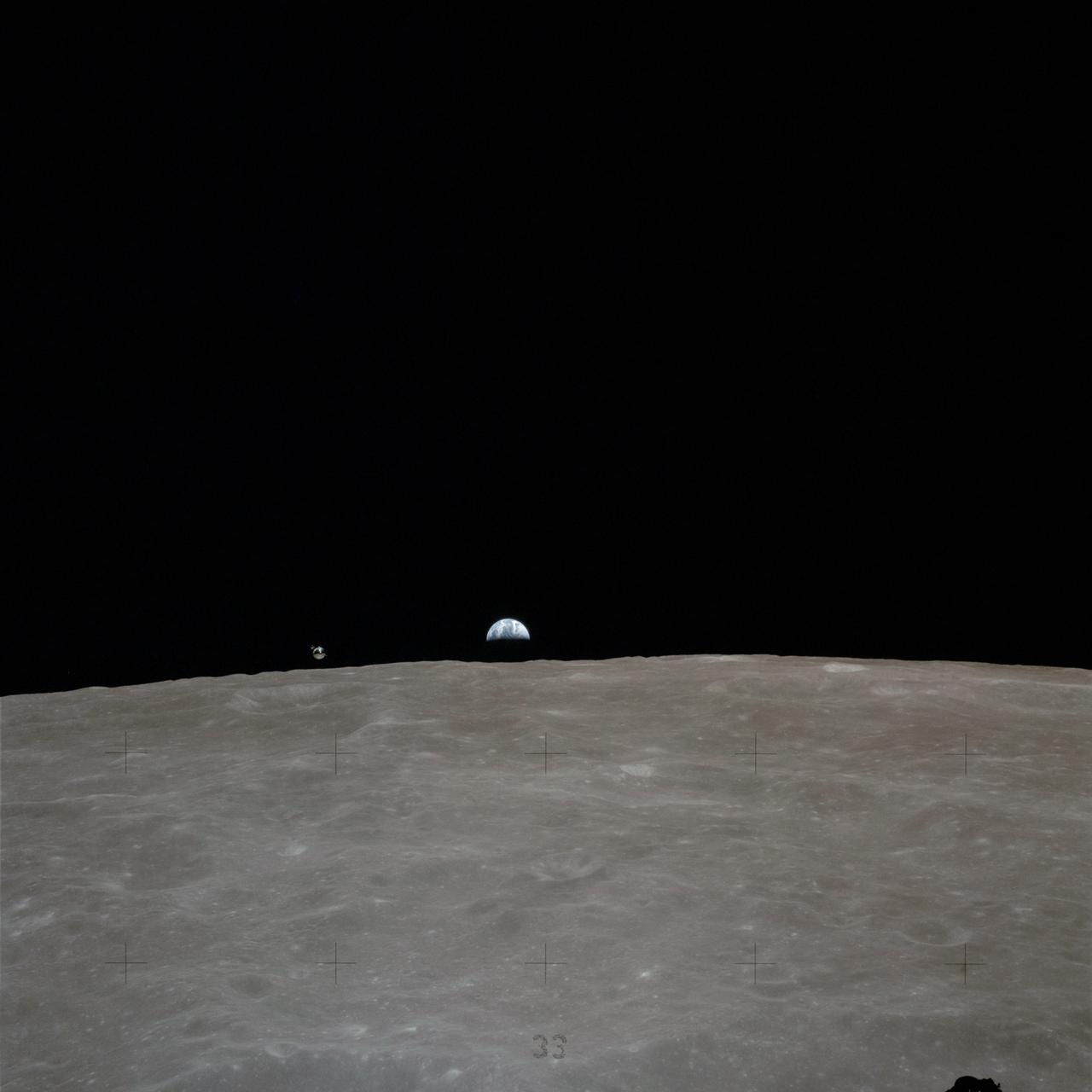 AS16-113-18289 (16-27 April 1972) --- Earth rises over the lunar horizon, with the Apollo 16 Command and Services Modules (CSM) to the left of Earth. This photograph was taken from the Lunar Module (LM) "Orion" before the two Apollo 16 spacecraft re-joined following the CSM's failure to make the circularization burn on April 20, 1972. Astronaut Thomas K. Mattingly II, command module pilot, was inside the CSM "Casper", while astronauts John W. Young, commander, and Charles M. Duke Jr., lunar module pilot, were manning the LM. While astronauts Young and Duke descended in the LM to explore the Descartes region of the moon, astronaut Mattingly remained with the CSM in lunar orbit. Photo credit: NASA