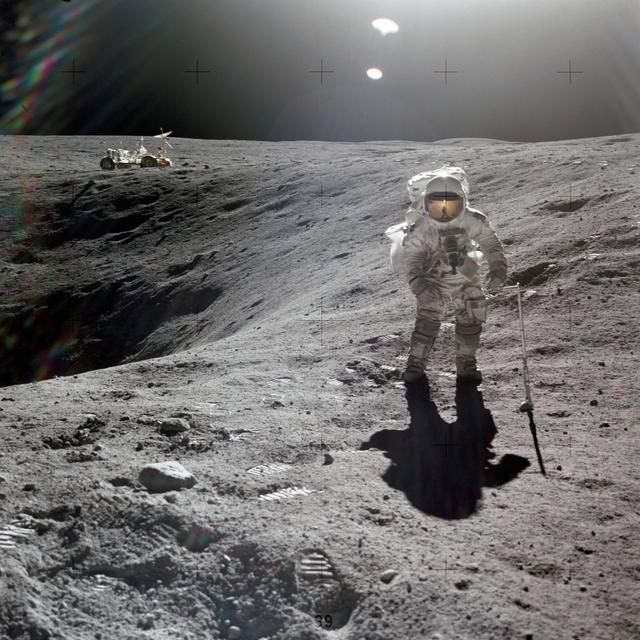 NASA image: Astronaut Charles Duke photographed collecting lunar samples at Station 1