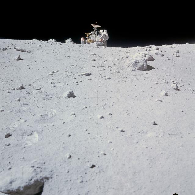NASA image: Astronaut Charles Duke works at front of Lunar Roving Vehicle