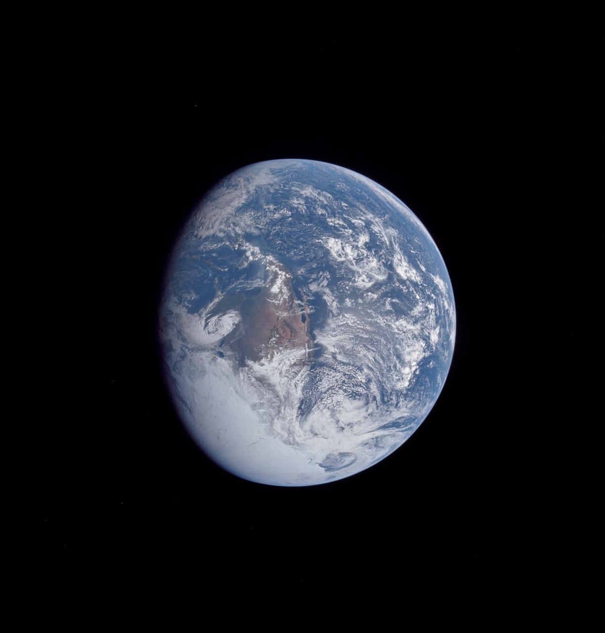 AS16-118-18885 (16 April 1972) --- A good view of Earth photographed about one and one-half hours after trans-lunar injection on April 16, 1972. Although there is much cloud cover, the United States in large part, most of Mexico and some parts of Central America are clearly visible. Note Lake Michigan and Lake Superior and the Bahama Banks (see different shade of blue below Florida). Just beginning man's fifth lunar landing mission were astronauts John W. Young, commander; Thomas K. Mattingly, II, command module pilot and Charles M. Duke Jr., lunar module pilot. While astronauts Young and Duke descended in the Lunar Module (LM) "Orion" to explore the Descartes highlands region of the moon, astronaut Mattingly remained with the Command and Service Modules (CSM) "Casper" in lunar orbit.