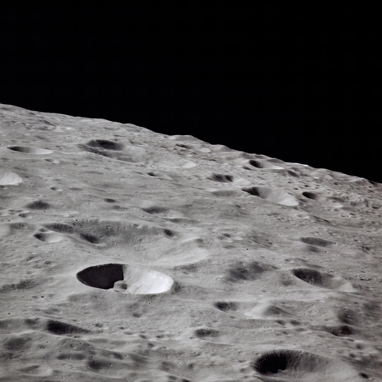 AS16-118-18964 (16-27 April 1972) --- This lunar farside oblique view from the Apollo 16 spacecraft in lunar orbit shows the Leonov Crater, just to the left and above the principal point of the photograph. Just beyond the horizon lies the Moscow Sea.